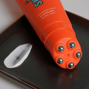 Bomb Bum body cream with metallic massager for firm skin