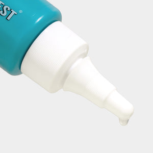 Close-up of a teal and white bottle with a nozzle on a light gray background
