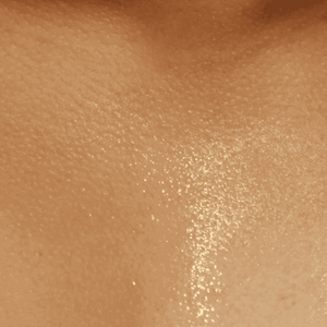 Close-up of beige skin texture with a slight sheen