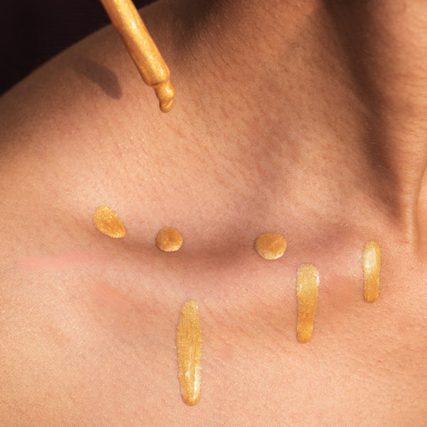 Molten gold shimmer drops with body brush