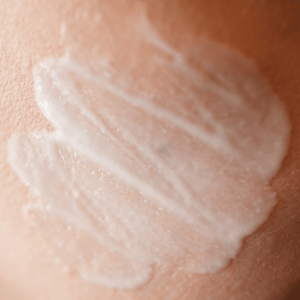 Close-up of a swatch of white cream on skin