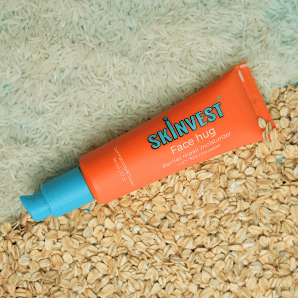 Skinvest Face Hug tube on a textured surface
