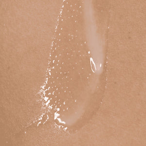 Close-up of a beige cosmetic product on skin