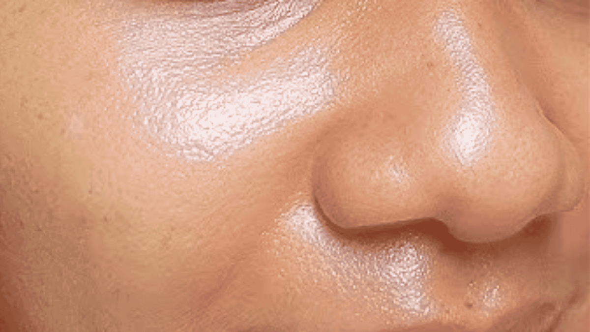 Close-up of a person's nose with a blurred background