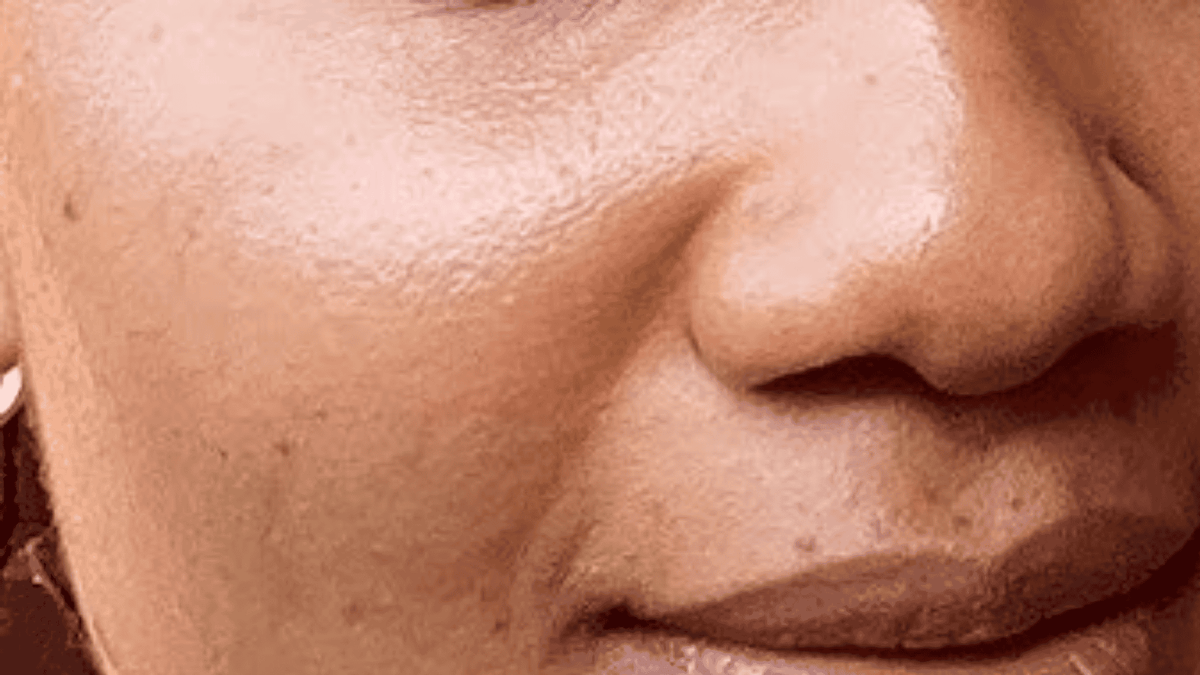 Close-up of a person's face with a focus on the nose and mouth area.